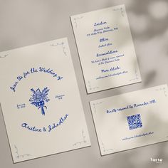 two wedding cards with blue ink on them