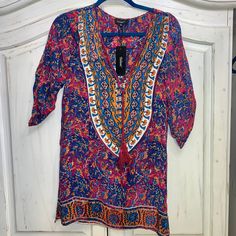 Brand New With Tag From Tolani. Bought At Revolve Clothing. Silk Boho Style Dress With Mandala On Back. Xs. Style Is Madison. Vibrant Print V-neck Tunic, Purple Tunic Dress For Beach Cover-up, Bohemian Multicolor V-neck Tunic, Printed V-neck Festival Tunic, Purple Floral Print Tunic Dress, Festival V-neck Printed Tunic, Printed V-neck Tunic For Festival, Purple Boho Print Dress For Festivals, Bohemian Purple Tunic Dress