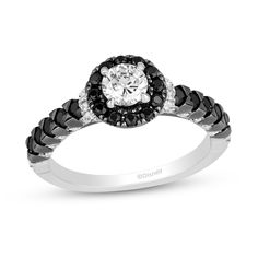 Celebrate your contrasting but complimentary personalities with this white and black diamond engagement ring from the Enchanted Disney Fine Jewelry Villains Collection inspired by Maleficent. Crafted in 14K white gold The sparkling 1/2 ct. round center diamond sparkles in a frame of alluring black diamonds. White diamonds shimmer along collar details while bold black diamonds line the crown-detailed shank. Diamond-touched black-rhodium plated claw details and a black rhodium-plated tiara design Black Diamond Wedding Rings Zales, Elegant Diamond White Rings With Black Diamonds, Disney Engagement Rings Black, Luxury Black Diamond Ring With Black Spinel, Zales Disney Engagement Rings, Disney Fine Jewelry, Enchanted Disney Fine Jewelry, Diamond Picture, Gold Book