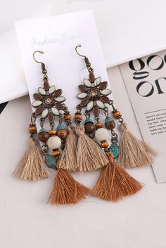 Looking for a unique and stylish addition to your jewelry collection? Look no further than our Chestnut Boho Bead Dangle Earrings! Handcrafted with beautiful chestnut beads and a boho dangle design, these earrings will add a touch of bohemian flair to any outfit. Elevate your style with these stunning earrings today! Material: Alloy Brown Tassel Earrings For Summer, Adjustable Brown Bohemian Tassel Earrings, Bohemian Brown Tassel Earrings, Brown Bohemian Tassel Earrings, Summer Brown Tassel Earrings, Handmade Brown Tassel Earrings, Brown Dangle Tassel Earrings For Summer, Brown Dangle Earrings With Tassels, Bohemian Brown Tassel Earrings For Summer