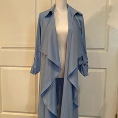 Beautiful Blue Duster. Nice, Soft Material. Bought For A Photo Shoot And Never Worn. Still Like Brand New. Size Small But Could Fit Medium. It’s Nice And Loose. Elegant Blue Open Front Outerwear, Chic Light Blue Summer Outerwear, Chic Blue Outerwear For Day Out, Chic Blue Summer Outerwear, Trench Coats, Beautiful Blue, Soft Material, Photo Shoot, A Photo