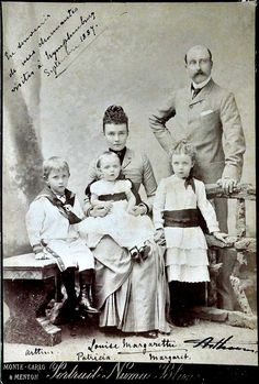 an old black and white photo of a family