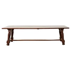 a wooden table sitting on top of a white floor