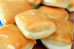 some bread rolls sitting on top of a blue plate