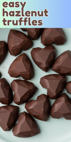 chocolate truffles on a plate with the words easy hazelnut truffles