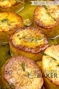 baked potatoes with herbs and seasoning in a pan