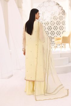 Curated on pure lemon yellow organza with hand zardosi craftmenship in dabka, naqshi, zari, resham, sequins and crystals. The length of the long shirt is 47 inches with crushed silk flappers. The pure organza matching dupatta is adorned with hand block print trellis. Turn heads in “ Gulsym “ Order Duration: 6 to 8 week Hand Block Print, Lemon Yellow, Long Shirt, Women Dress, Baby Dress, Block Print, Lemon, Wedding Dress, Pure Products