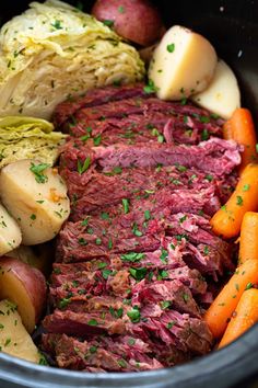 corned beef with potatoes and carrots in a slow cooker