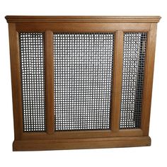 a wooden cabinet with metal mesh doors on the front and back sides, against a white background