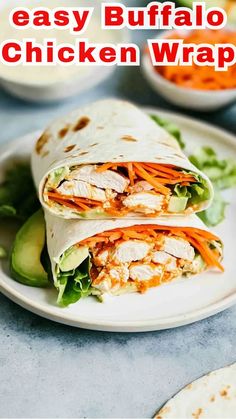 a chicken wrap on a white plate with lettuce and carrots