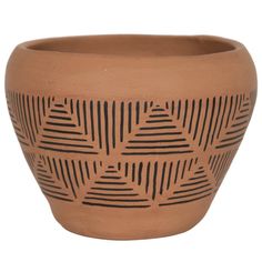 a brown pot with black lines on it