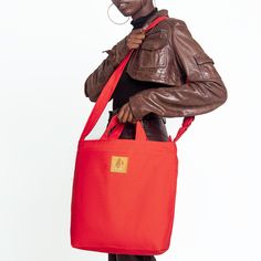 Take on your day in style. Our Carry-All Tote features a zippered opening, an interior pocket and adjustable shoulder strap. Great for a large purse or an every-day bag to throw everything in that you’ll need for the day. This bag is proudly made in our small workshop in Nairobi’s eastlands with local fabric from a small family-owned mill and interior trim of African kitenge fabric. What you'll love about The Amani Carry All Bag ✔ Zippered opening.✔ Interior pocket.✔ Adjustable shoulder strap.✔ Kitenge Fabric, Large Purse, Small Workshop, Kitenge, Carry All Bag, Nairobi, Day Bag, Interior Trim, Small Family