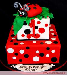 a lady bug themed birthday cake for a one year old