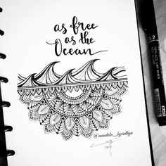 a spiral notebook with the words as free as the ocean written in black ink on it