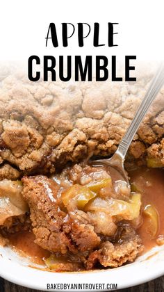 an apple crumble in a white bowl with a spoon on it and the title above it