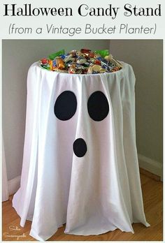 a halloween candy stand made from a vintage bucket planter