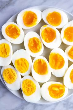 eggs are arranged on a white plate with the words nualadi written below it