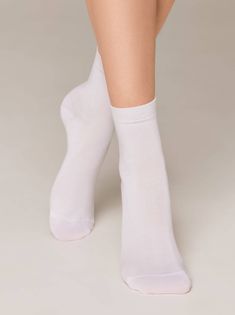 This classic sock features a luxurious blend of Tencel (Viscose) and spandex for superior comfort and durability. The breathable, moisture-wicking material keeps feet cool, dry, and comfortable throughout the day, while the spandex ensures a perfect snug fit. Enjoy a comfortable and stylish sock experience without compromising on quality. 70% Tencel (Viscose), 28% Polyamide, 2% Elastane Stylish Socks, Warm Socks, High Knees, Womens Tights, Sock Gifts, Ankle Socks, Bra Lingerie, Socks For Sale, Mens Socks