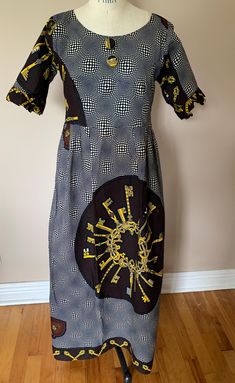 Love all the patterns in this dress. Black and white optic pattern, keys, hearts. Hand made, no label. Cotton wax print. Ruffled short sleeves, decorative front buttons, back zipper. Measurements are: 13 1/2" across top shoulder seams, 16 1/2" across the back under armholes, 15 1/2" under bust, 50" length. African Print Dress, Dress Black And White, Ruffle Shorts, Wax Print, Dress Clothes For Women, African Print, Dress Black, Halloween Shopping, Print Dress