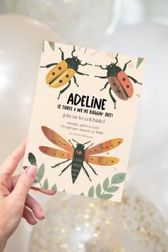 a person holding up a card with two bugs on it and the words, appline is