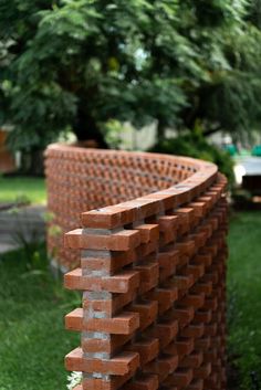 a close up of a brick wall in the grass