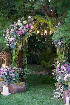 an outdoor ceremony with flowers and candles