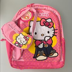 16 Inches. Backpack With Matching Purse Pink Hello Kitty Backpack For End Of School Year, End Of School Year Pink Hello Kitty Backpack, End Of School Year Hello Kitty Pink Backpack, Pink Hello Kitty School Backpack, Pink Hello Kitty Backpack, Pink Hello Kitty Backpack For Back To School, Playful Hello Kitty Backpack For Back To School, Pink Hello Kitty Print Casual Backpack, Multicolor Hello Kitty Travel Backpack