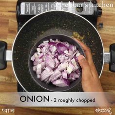 onions being cooked in a frying pan on top of a wooden table with the words onion 2 roughly chopped