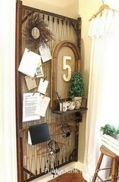 a room with a chair, table and clock on the wall