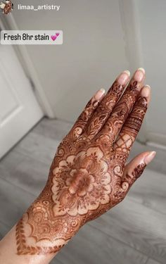 a woman's hand with henna on it and the words fresh bhri stain