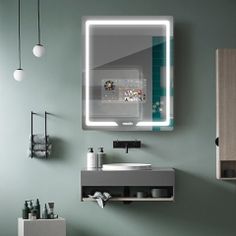 a bathroom with a sink, mirror and lights on the wall next to toiletries