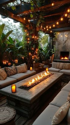 a fire pit sitting on top of a wooden floor next to couches and tables