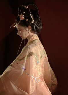 For the summer goddess, this gorgeous Tang Dynasty inspired set is adorned head to toe with embroideries of peonies, phoenixes and feathers. Not one corner is neglected! From the wrists to the back, envelop yourself in the luxuries of high quality flowers. The Daxiushan (大袖衫, wide sleeved jacket) is dramatic and elegant, creating movement and grace with its exaggerated sleeves. Layer the embroidered jacket over the sheer jacket for a dimensional effect. The star of the show is the Heziqun (诃子裙, Wedding Kimono With Floral Embroidery, Traditional Spring Kimono, Traditional Spring Wedding Kimono, Spring Wedding Kimono With Floral Embroidery, Spring Wedding Embroidered Kimono, Pink Bohemian Kimono For Wedding, Bohemian Pink Kimono For Wedding, Pink Bohemian Wedding Kimono, Traditional Summer Wedding Kimono