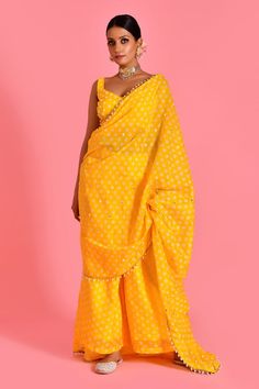 Yellow palazzo with bandhani pattern and pearl tassel embellished border on attached pallu. Paired with embellished padded blouse. - Aza Fashions Fitted Pre-draped Saree With Gota Work, Festive Pre-draped Saree With Gota Work, Festive Tissue Silk Palazzo Set For Navratri, Festive Tissue Silk Palazzo Set, Designer Wear Palazzo Set For Diwali, Traditional Drape Palazzo Set With Zari Work For Navratri, Festival Palazzo Set With Mirror Work, Traditional Drape Palazzo Set With Mirror Work For Festivals, Designer Traditional Drape Palazzo Set For Diwali