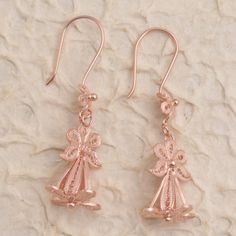 Refresh your look with this pair of unique dangle earrings from Bali's Yuniati. Crafted from 18k rose gold plated sterling silver filigree the earrings are designed with a floral motif and finished with oxidized details. Rose Gold Sterling Silver Filigree Jewelry, Rose Gold Pierced Flower Earrings For Formal Occasions, Rose Gold Flower Earrings For Formal Events, Elegant Rose Gold Filigree Earrings, Elegant Dangle Flower Earrings With French Hook, Rose Gold Dangle Flower Earrings In Sterling Silver, Rose Gold Sterling Silver Dangle Flower Earrings, Rose Gold Filigree Dangle Jewelry, Rose Gold Dangle Flower Earrings