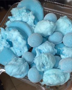 a plastic container filled with blue jello and marshmallows