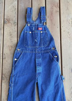 Vintage Y2K DICKIES Blue Denim Carpenter Bib Overalls Medium Wash. Straight leg, adjustable shoulder straps and button fly.  In great condition. No tears no stains. See pictures.  Fits and measures like a women's S. But please see measurements below. Machine washed and ready to wear.  waist across 15.5" leg inseam: 31" hip across: 20" Rise: 11.5" Bib Overalls, Denim Jumpsuit, Shoulder Straps, Vintage Y2k, Blue Denim, Overalls, Ready To Wear, Straight Leg, Bathing Beauties