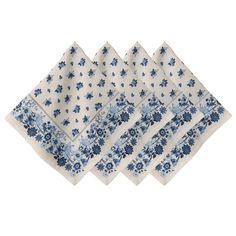 four napkins with blue flowers on them