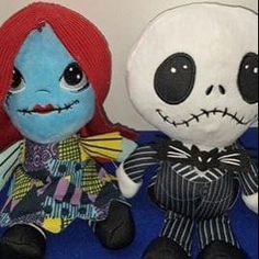 two stuffed toys sitting next to each other