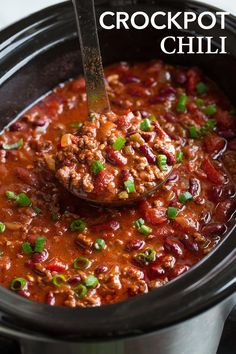 crockpot chili in a slow cooker with a ladle scooping out