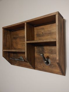 a wooden shelf with two metal handles on it