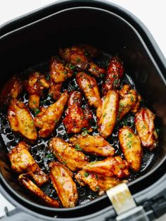 chicken wings are cooked in an air fryer