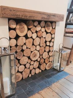 a fireplace with logs stacked on top of it