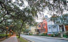 a street lined with colorful houses and trees