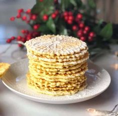 a stack of cookies sitting on top of a white plate