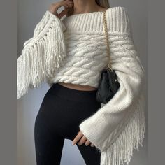 Cozy up in our Juliana Tassel Sleeve Cable Knit Sweater! The dramatic tassel sleeves and off-the-shoulder cable knit give this sweater a unique western flair, making it perfect for any occasion. Stay warm and stylish with this must-have addition to your wardrobe. Gender: WOMEN Item Type: Tops, Sweater Material: Cotton/Polyester/Acrylic Decoration: Tassel, Cable Knit Collar: Slash Neck, Off the Shoulder Elasticity: Slight Strech Sleeve Style: Flare Sleeve Thickness: Standard Material Composition: White Tassel, Off Shoulder Sweater, Women Sleeve, Sweater Women, Knitted Pullover Sweaters, Knit Jumper, Shoulder Sweater, Look Chic, Ponchos