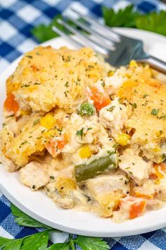 a white plate topped with chicken and vegetable casserole