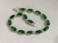 Vintage Sterling Silver Marquise cut Emerald Link Chain Bracelet....Marked 925...Total of weights 9.8grams...Measure 7 1/2'' Length W 5.0MMIt's in very good condition. Green Multi-stone Marquise Jewelry, Luxury Green Sterling Silver Bracelet, Green Sterling Silver Bracelets, Fine Jewelry, Nickel-free Green Sterling Silver Bracelet, Vintage Green Nickel-free Bracelet, Flower Band, Emerald Pendant, Marquise Cut, Sterling Silver Flowers