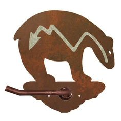 an animal shaped metal hook with a brown handle and white arrow on it's side