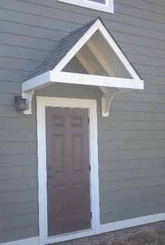 a house with a brown door and white trim